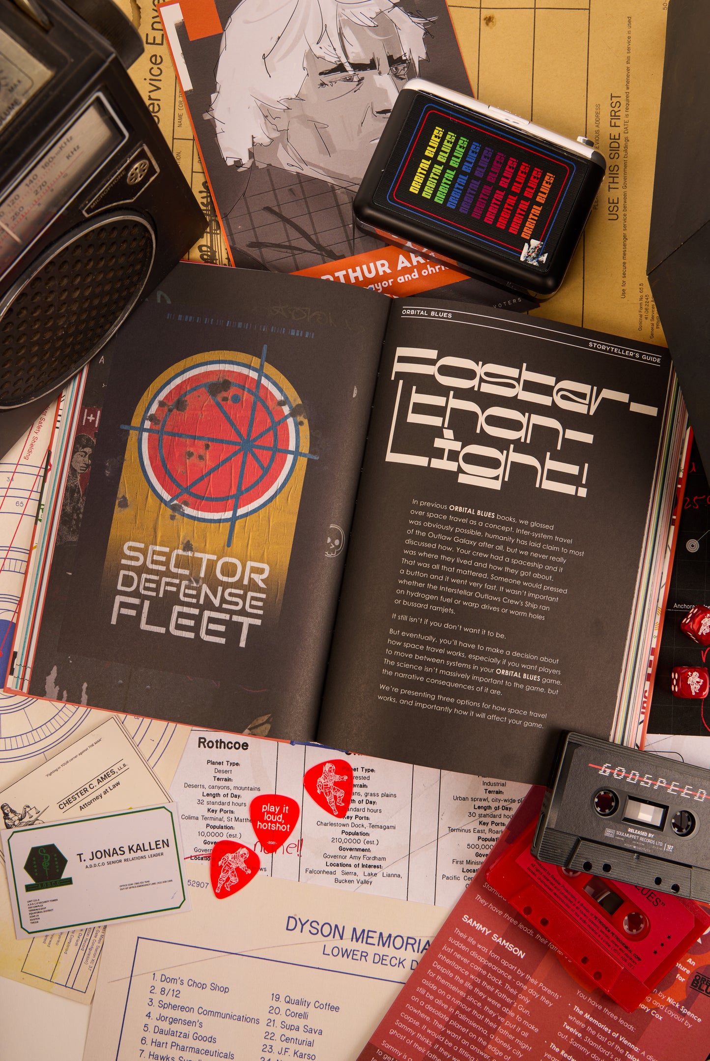 Double page spread of Afterburn titled "faster than light" surrounded by cassettes and other various items
